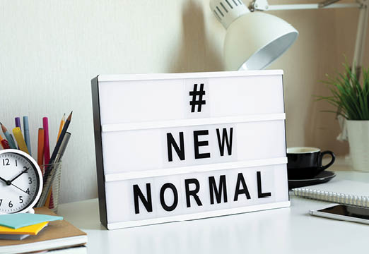 A word board that says new normal